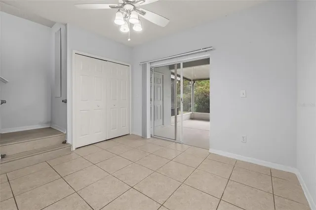 wooden floor in an empty room with a kitchen