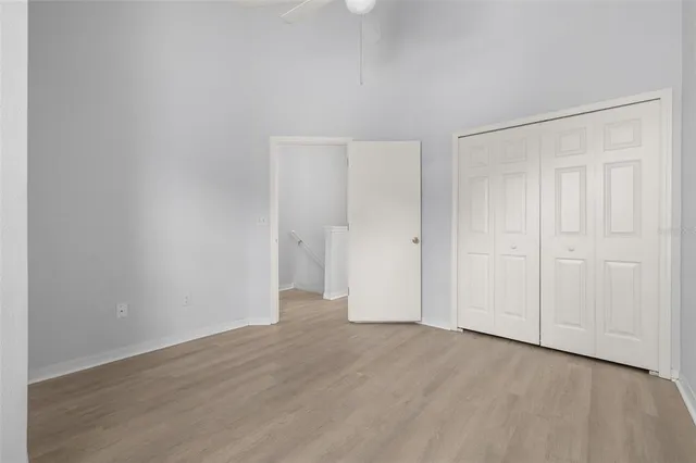 a bathroom with a granite countertop toilet a sink and a bathtub