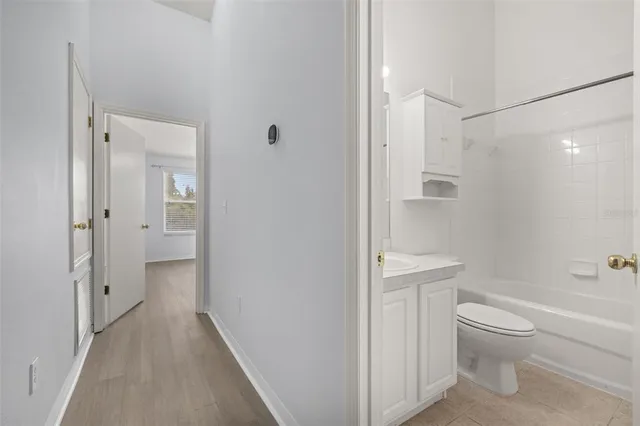 a bathroom with a sink a toilet and a bathtub