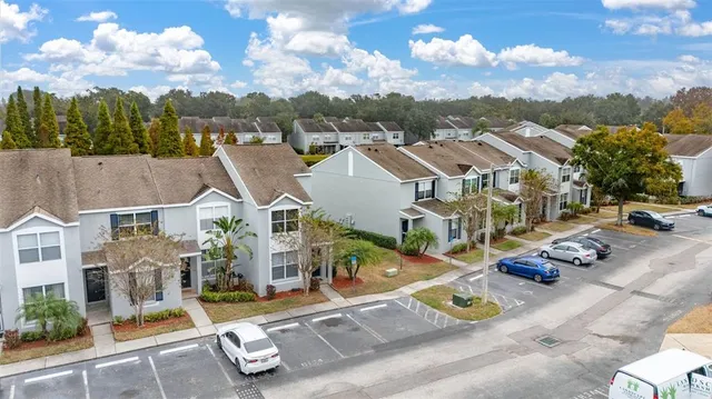 an aerial view of residential houses with outdoor space