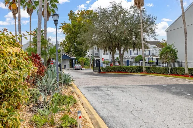 a view of house with swimming pool and sitting area