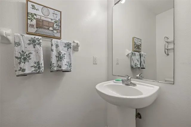 a kitchen with a stove sink and microwave