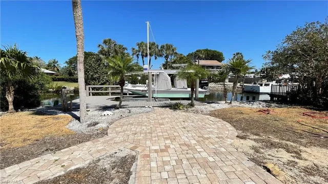 a view of a house with a snow in the yard