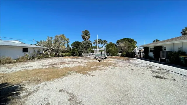 a view of a lake with a house in the background