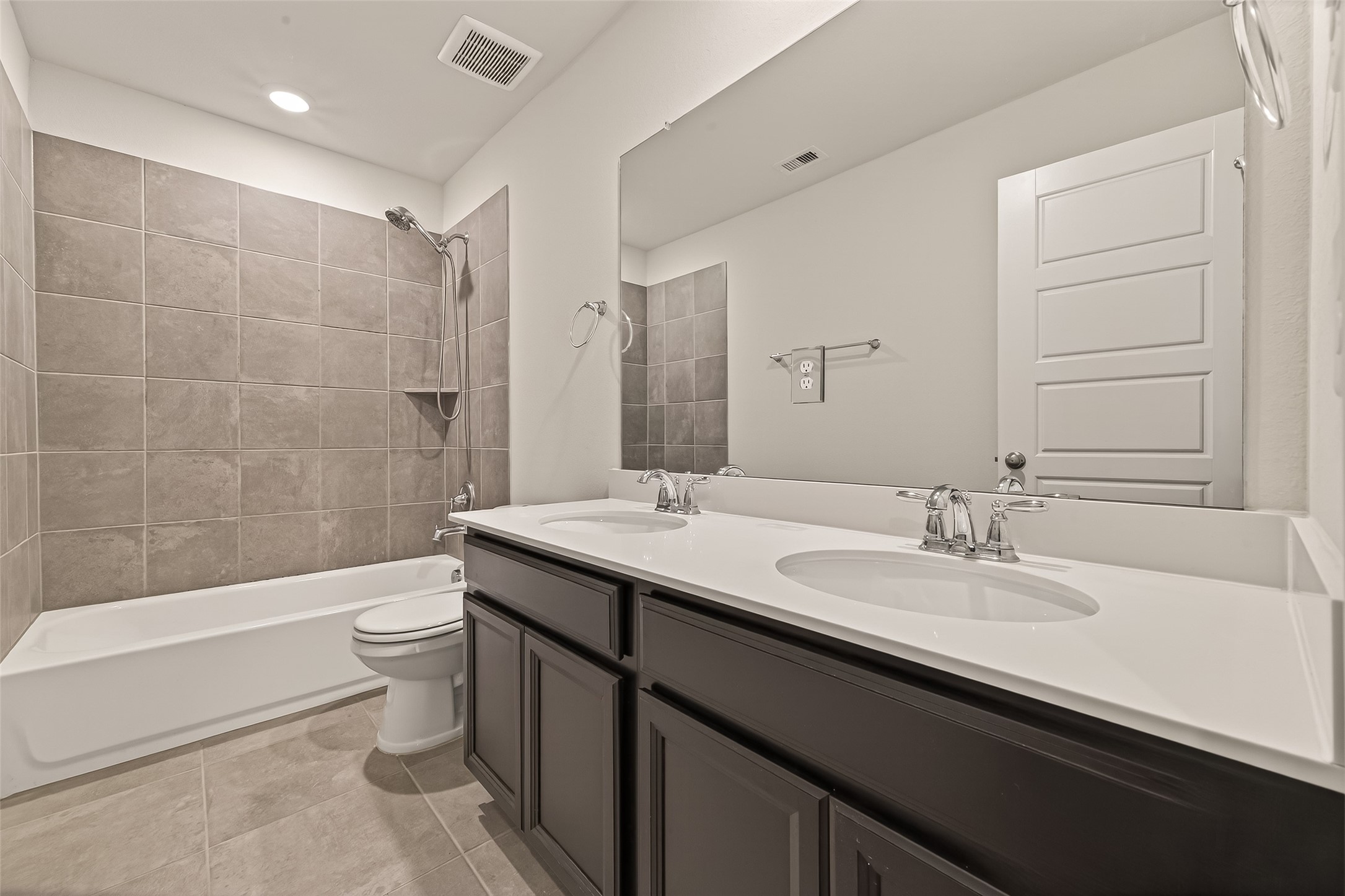 4231 Reese Ravine Lane Katy, TX 77493 - Photo 25 of 32 This bathroom with double sinks is convenient to the upstairs bedroom