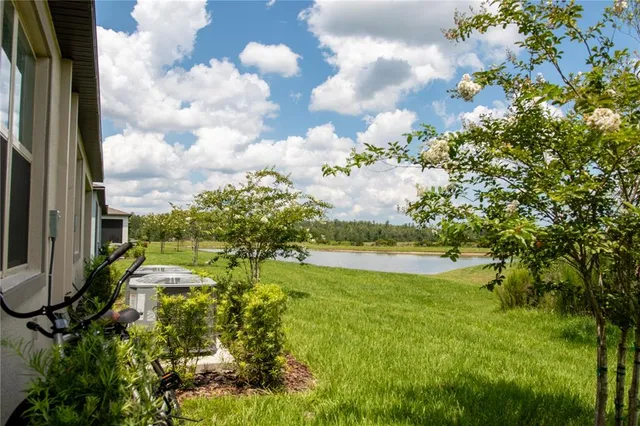 an aerial view of a house with a ocean view