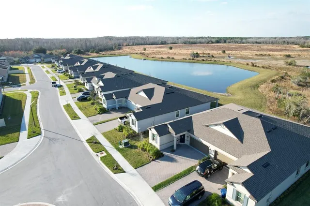 a view of swimming pool with outdoor seating and city view