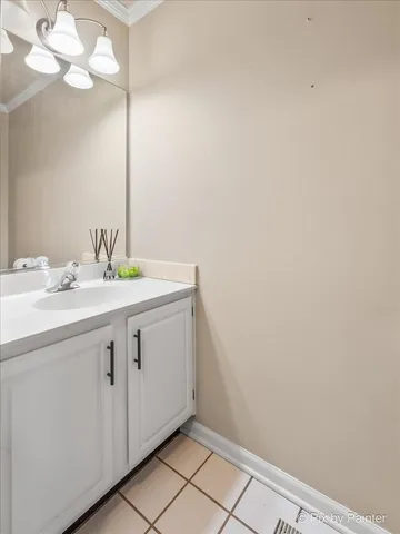 a bathroom with a sink vanity and a mirror