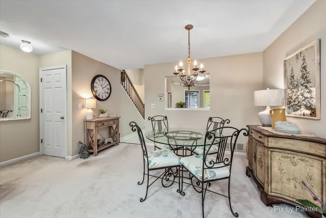 a view of a dining room and chandelier