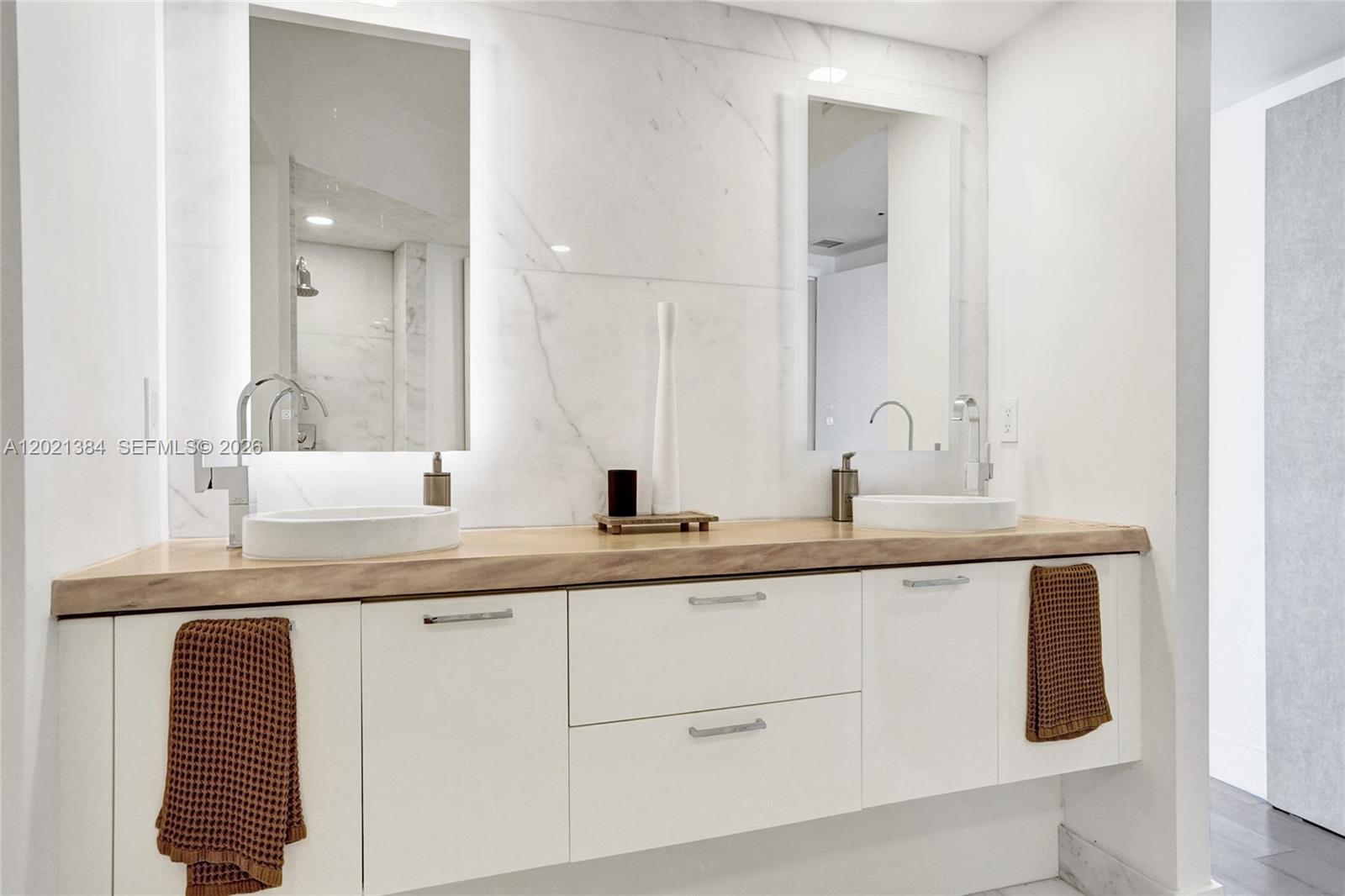 400 Alton Road, Unit PH11 Miami Beach, FL 33139 - Photo 29 of 49 a bathroom with a sink and a mirror