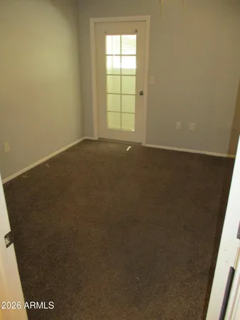 a white toilet sitting next to a bath tub