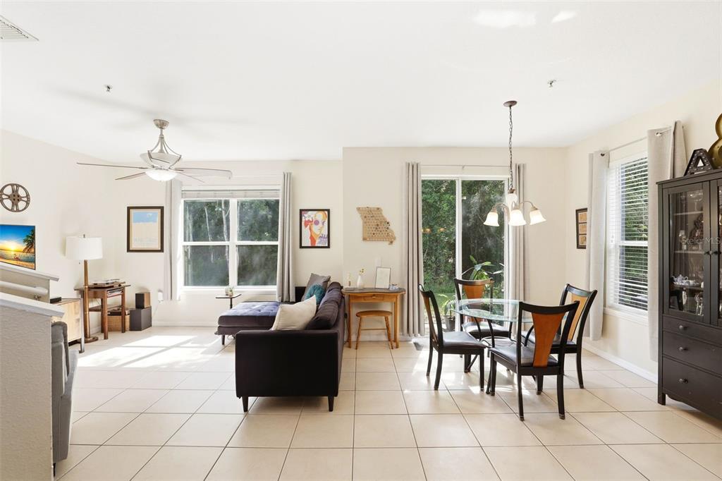 6458 South Goldenrod Road, Unit 29B Orlando, FL 32822 - Photo 6 of 40 a living room with furniture and large windows