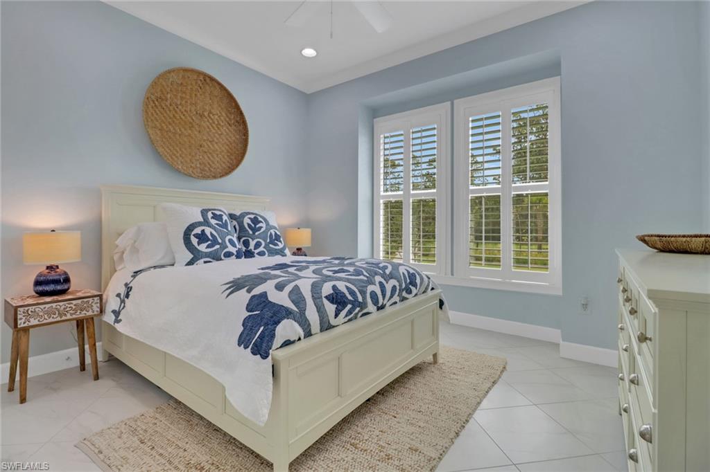 6509 Dominica Drive, Unit 101 Naples, FL 34113 - Photo 15 of 33 a bedroom with a bed and a window