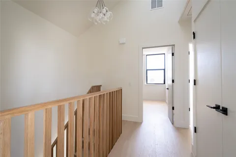 a bathroom with mirror and window