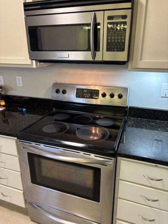 307 Quarry Street San Marcos, TX 78666 - Photo 16 of 38 Kitchen featuring stainless steel appliances and dark stone counters