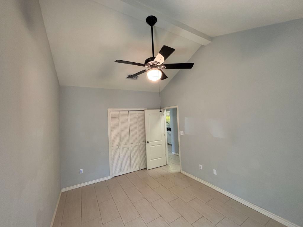 307 Quarry Street San Marcos, TX 78666 - Photo 27 of 38 Unfurnished bedroom with ceiling fan and a closet