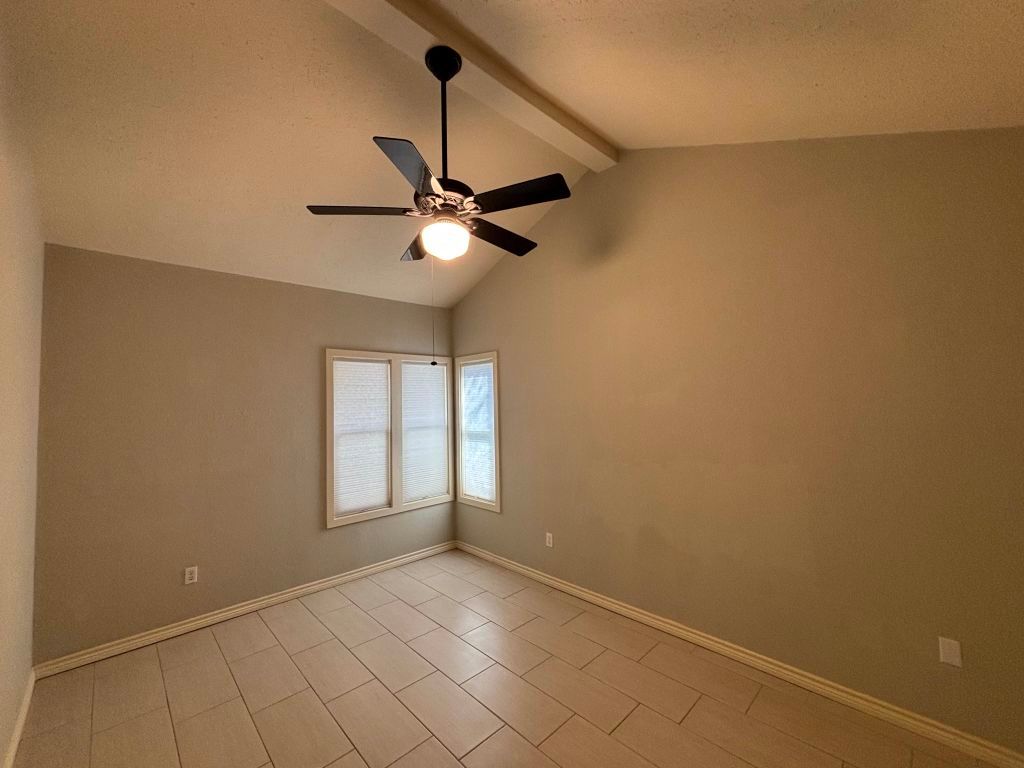 307 Quarry Street San Marcos, TX 78666 - Photo 28 of 38 Empty room with ceiling fan, a textured ceiling, and light tile patterned flooring