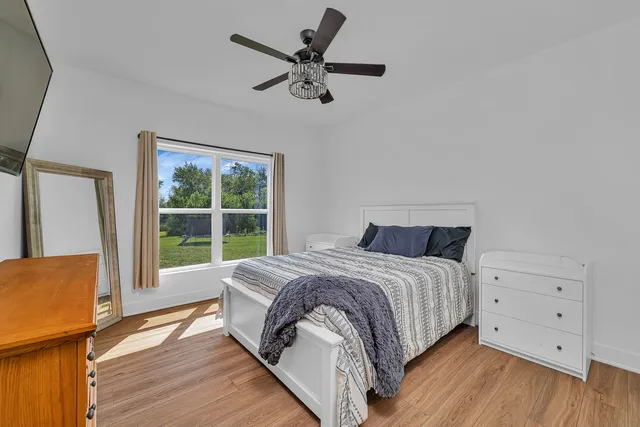 a bed room with a bed and a window