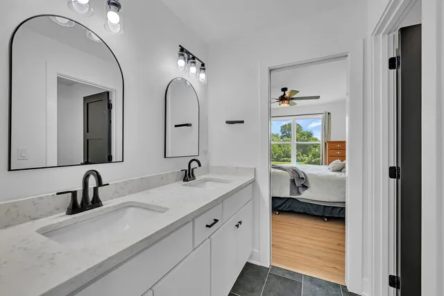 a white toilet sitting next to a shower