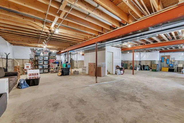 a view of a room with furniture and a flat screen tv