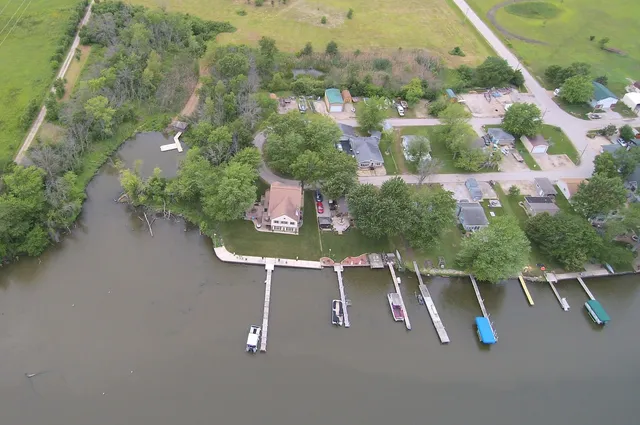 a view of a swimming pool with a yard