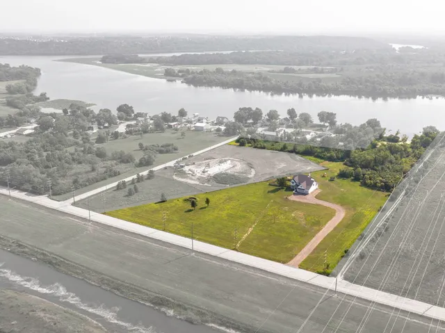 an aerial view of a house with pool lake view and mountain view
