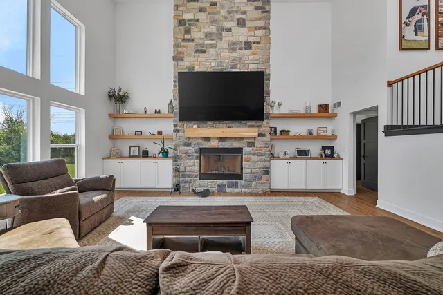 a living room with furniture fireplace and flat screen tv