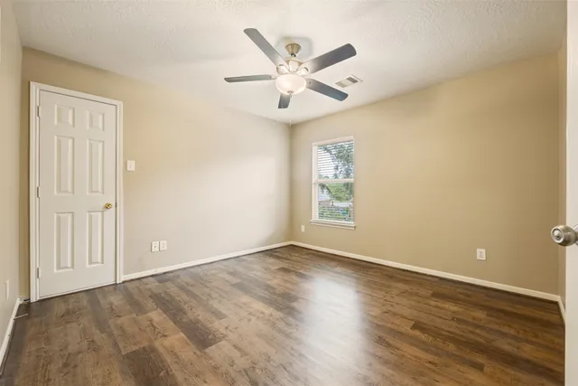 a view of a house with a yard and a porch