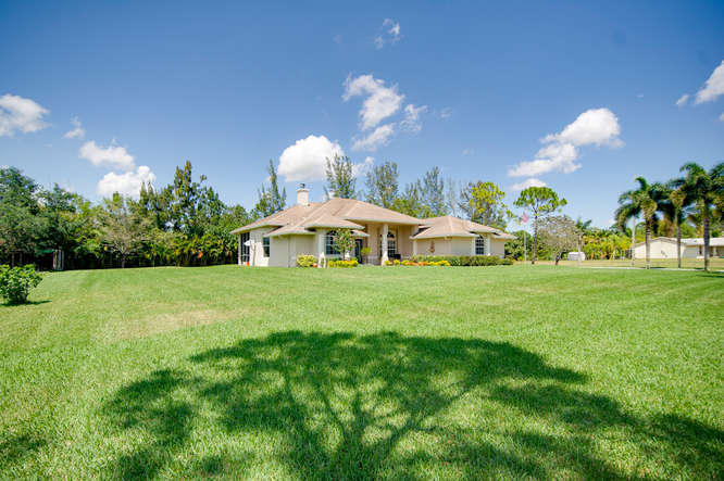 14713 86th Road North The Acreage, FL 33470 - Photo 3 of 51 14713 86th Rd N-small-003-2-Yard-666x444