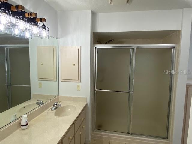 8427 Southwest 136th Street Ocala, FL 34473 - Photo 11 of 18 a bathroom with a granite countertop sink and a mirror