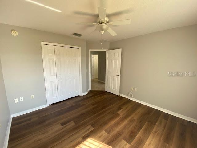 8427 Southwest 136th Street Ocala, FL 34473 - Photo 13 of 18 wooden floor in an empty room