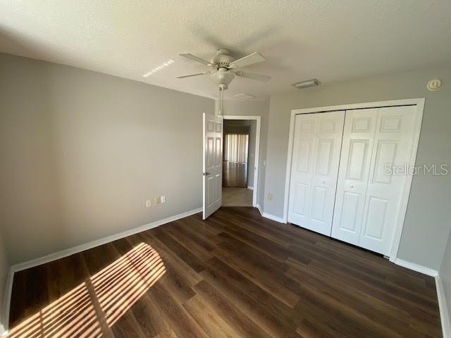 8427 Southwest 136th Street Ocala, FL 34473 - Photo 14 of 18 a view of an empty room with wooden floor