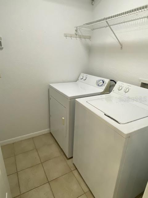 8427 Southwest 136th Street Ocala, FL 34473 - Photo 17 of 18 a utility room with dryer and washer