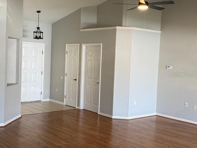 8427 Southwest 136th Street Ocala, FL 34473 - Photo 3 of 18 a view of an empty room with wooden floor