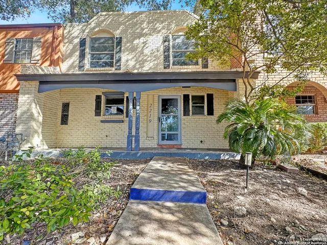 a view of an empty room and fire place