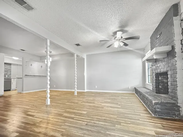 a kitchen with white cabinets stainless steel appliances and sink