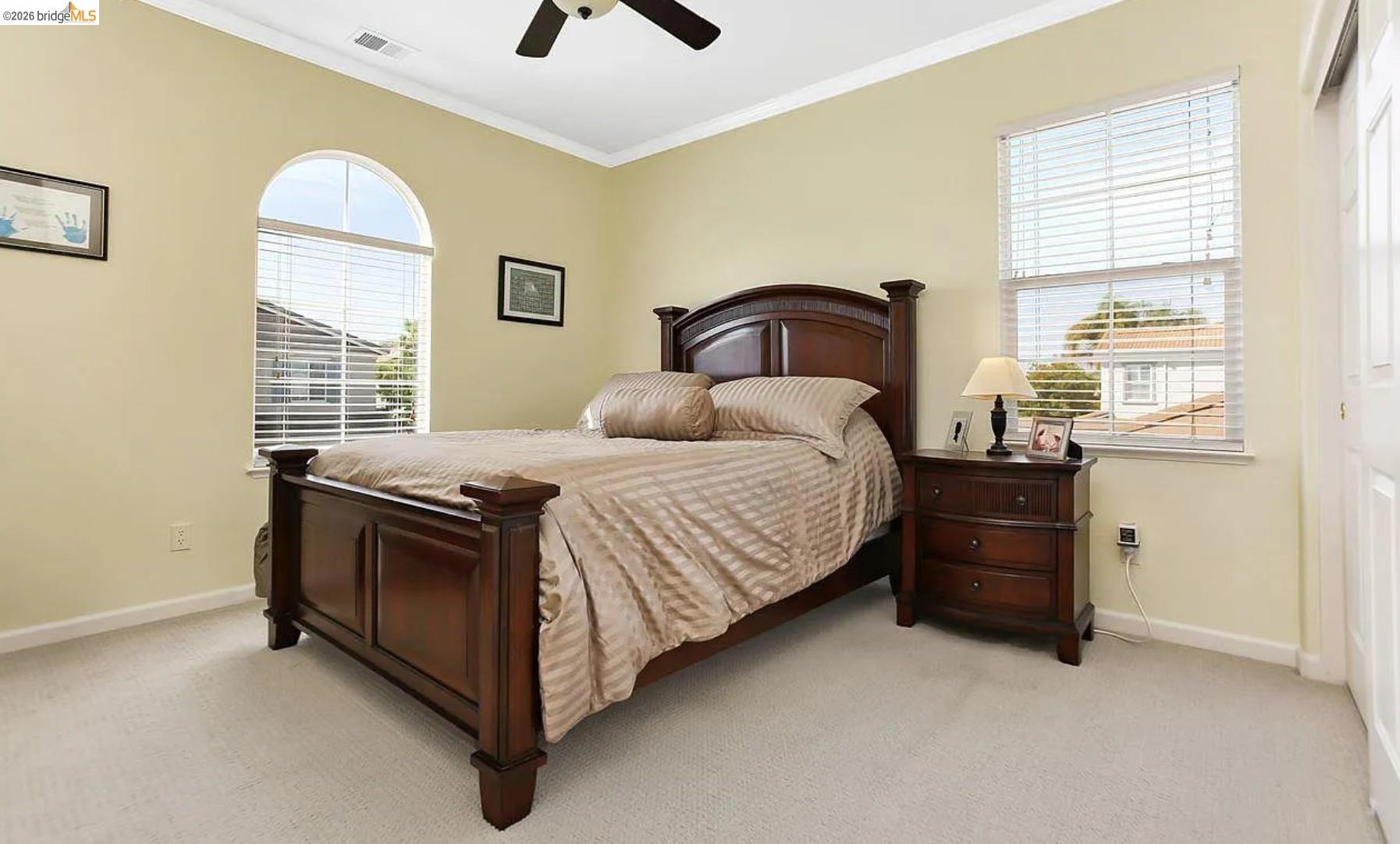 3251 Lookout Point Loop Discovery Bay, CA 94505 - Photo 20 of 31 Bedroom featuring light colored carpet, crown molding, and ceiling fan
