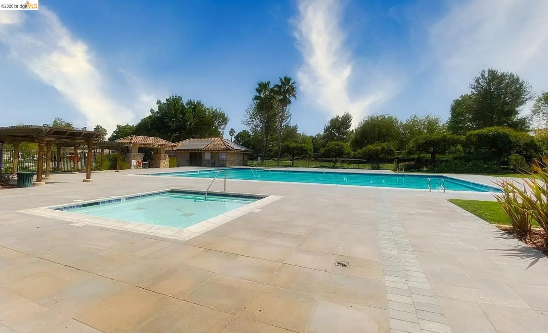 3251 Lookout Point Loop Discovery Bay, CA 94505 - Photo 30 of 31 Community pool featuring a patio area and a pergola