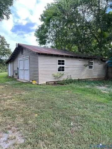 a backyard of a house with lots of green space