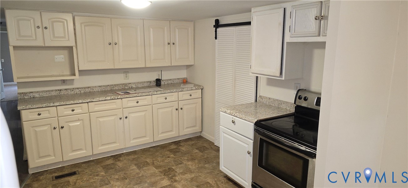 415 Garretts Mill Road Mineral, VA 23117 - Photo 20 of 43 a kitchen with granite countertop white cabinets and stainless steel appliances