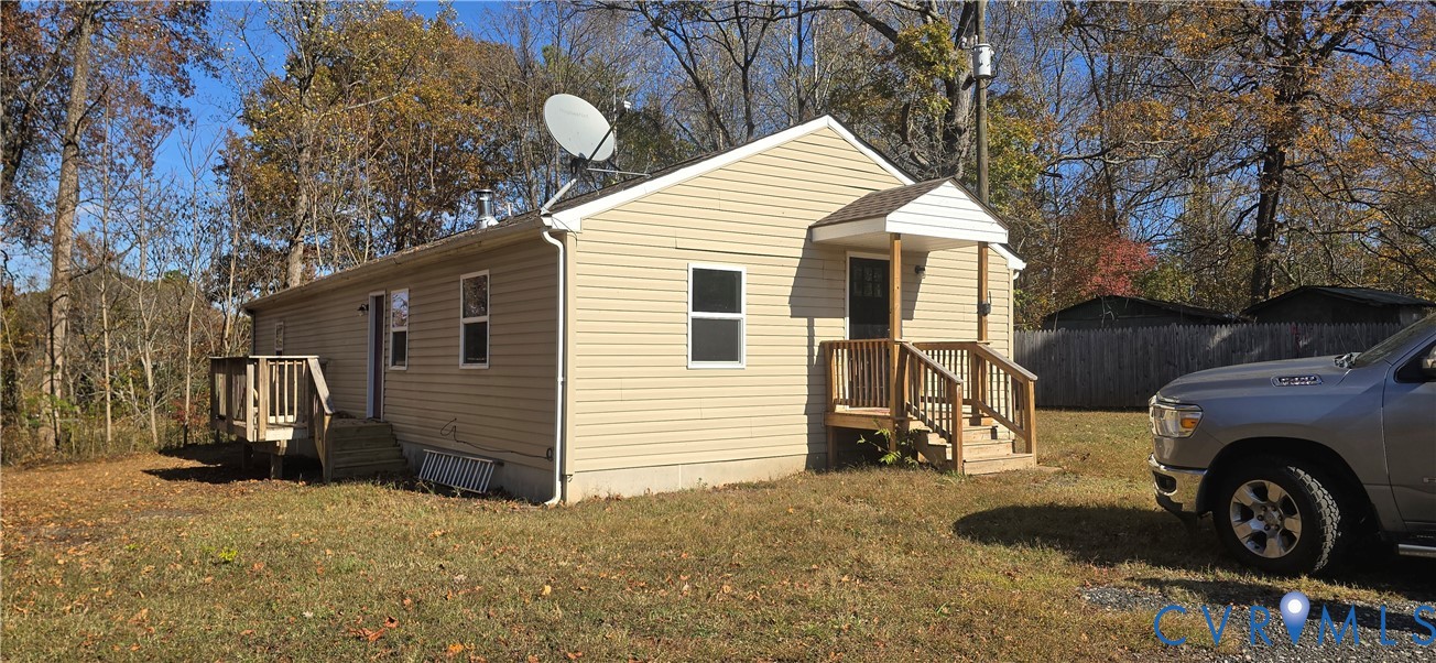 415 Garretts Mill Road Mineral, VA 23117 - Photo 2 of 43 a view of a house with a yard and garage