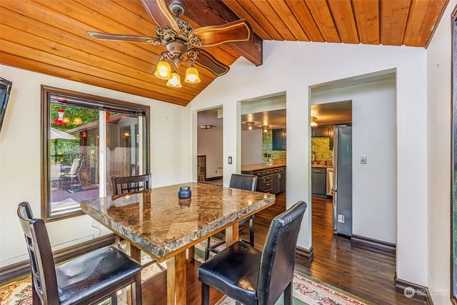 a dining room with furniture and window