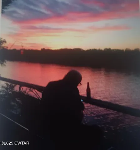 a living room with furniture and stairs