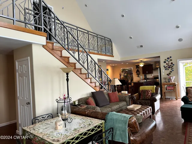 a dining table with chairs and window