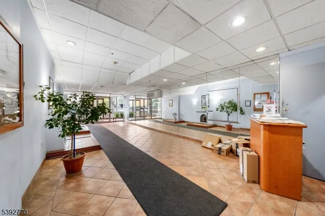 a view of a living room and kitchen