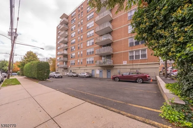 a view of a street with a building in the background