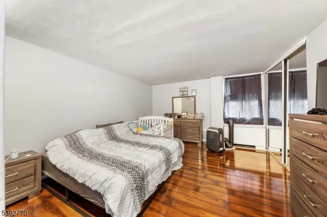 a bedroom with a bed and a table