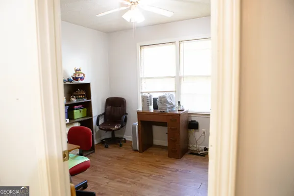 a workspace with furniture and a window