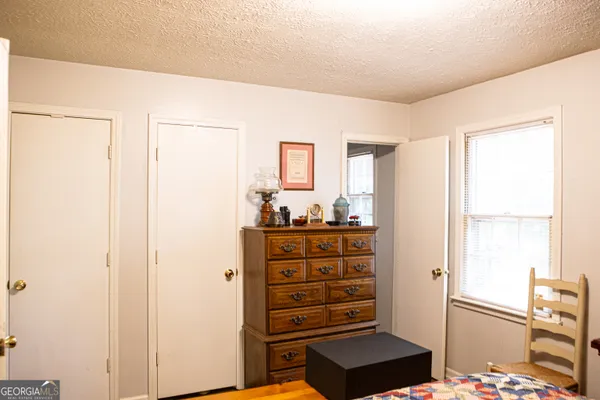 a view of dresser with wooden floor
