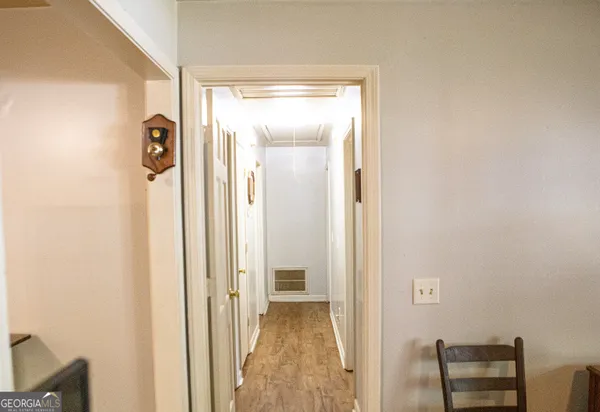 a view of a bathroom from a hallway